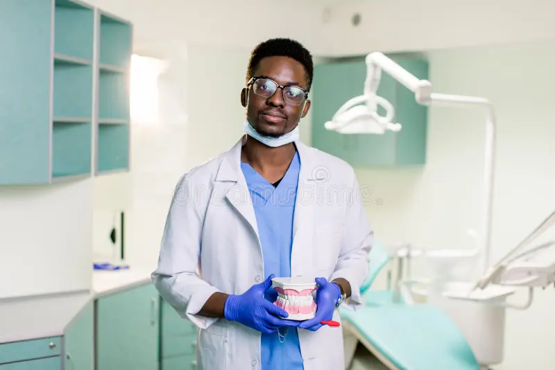 black dentist dental clinic holds artificial jaws his arms black dentist dental clinic holds artificial jaws his 174802107 black dentist dental clinic holds artificial jaws his arms black dentist dental clinic holds artificial jaws his 174802107