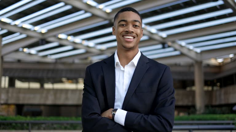a portrait of a confident smiling young black man a portrait of a confident smiling young black man